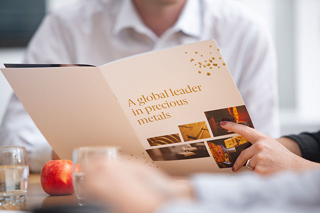 Reading a corporate brochure at The Perth Mint.