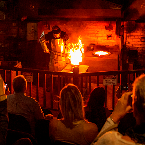 People watching a gold pour at  The Perth Mint.