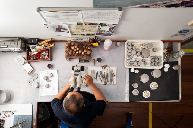 a birdseye view of a Perth Mint staff member working in die polishing