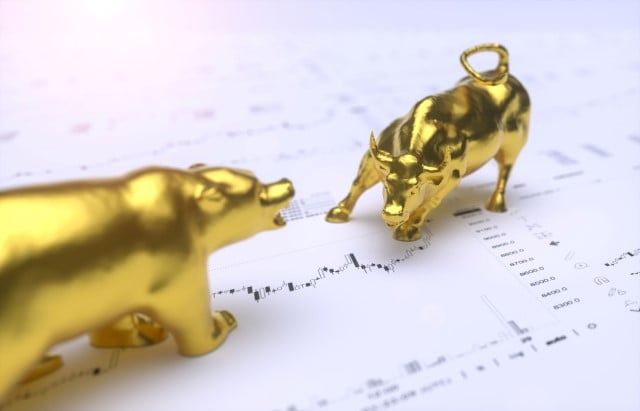 gold statues of a bull and bear