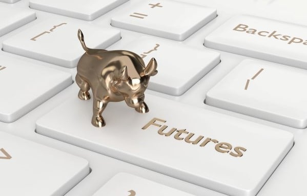 a golden bull standing on a keyboard with a key saying "futures"